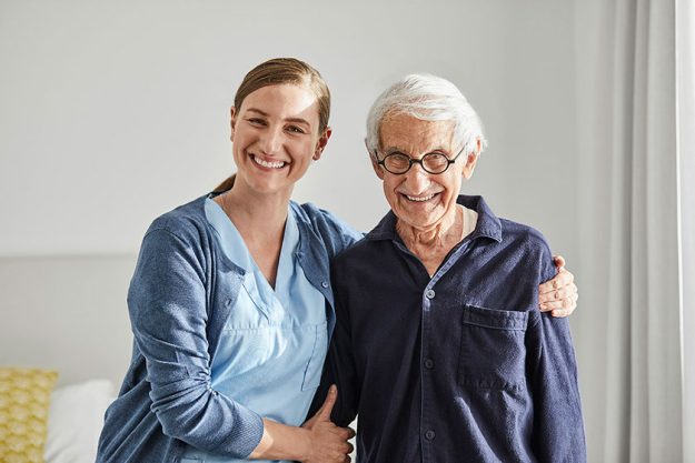 happy senior woman and caregiver happy senior woman and caregiver
