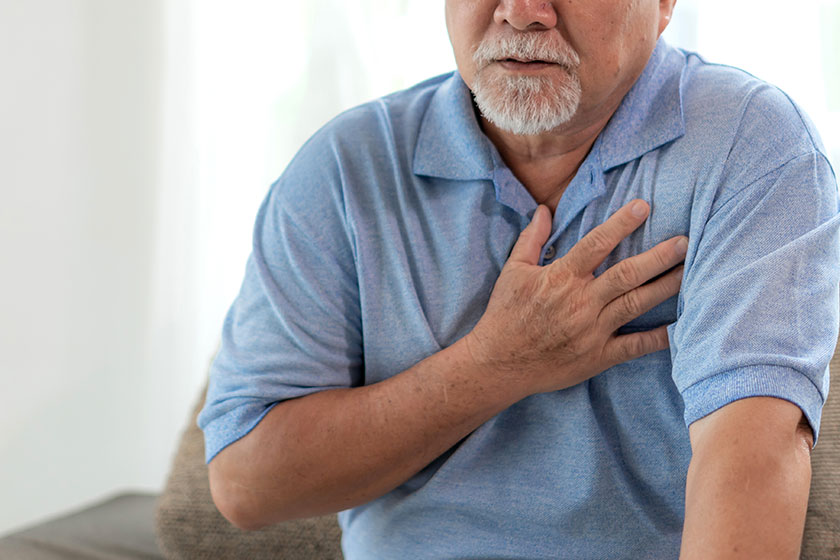 Senior male Asian suffering from bad pain