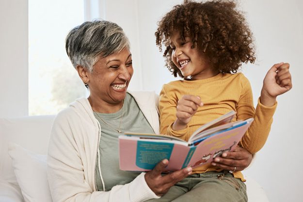 Happy family, grandmother and child reading book Happy family, grandmother and child reading book