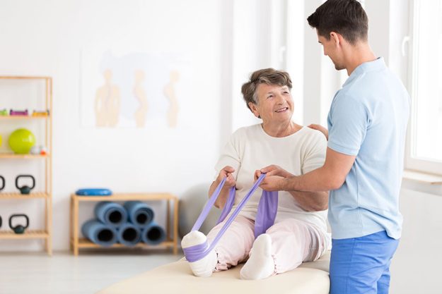 Elderly-woman-exercising-with-band Elderly-woman-exercising-with-band