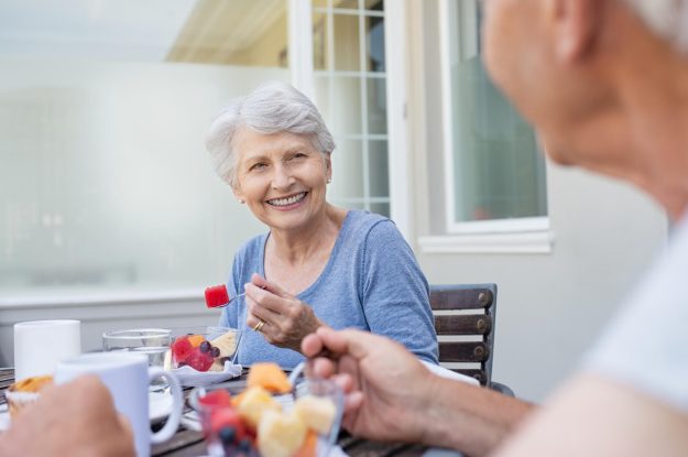 Happy,Senior,Woman,Eating,Fresh,Fruits,During,Breakfast.,Cheerful,Old
